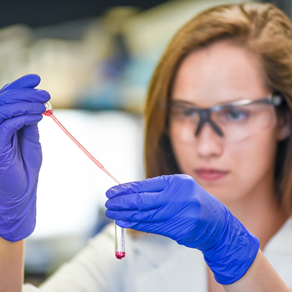 Postdoctoral researcher working in a biomedical research laboratory